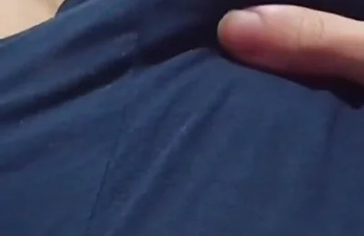 A Young Athletic Guy in Blue Shorts Is Massaging His Penis