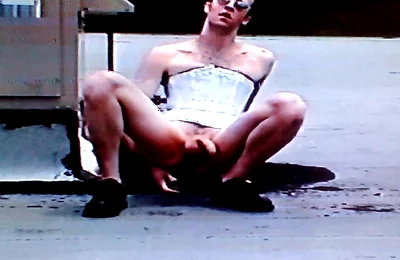 Crossdresser Riding a Giant Dildo on a Roof Top