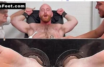 Brody Meyer In The Tickle Chair With An Electric Toothbrush On Balls