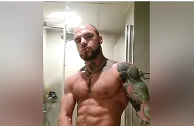 Bold Tattooed Jock Flexing In Bathroom And Jerking Massive Cock