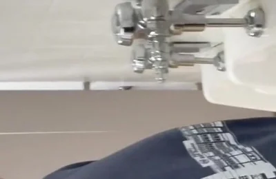 Pissing at a urinal with no dividers.